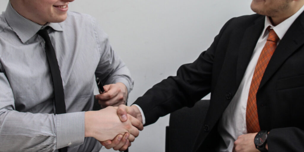 Lawyers shaking hands at an Indiana Law firm